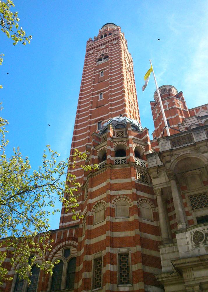 A tall tower of a brick built Cathedral